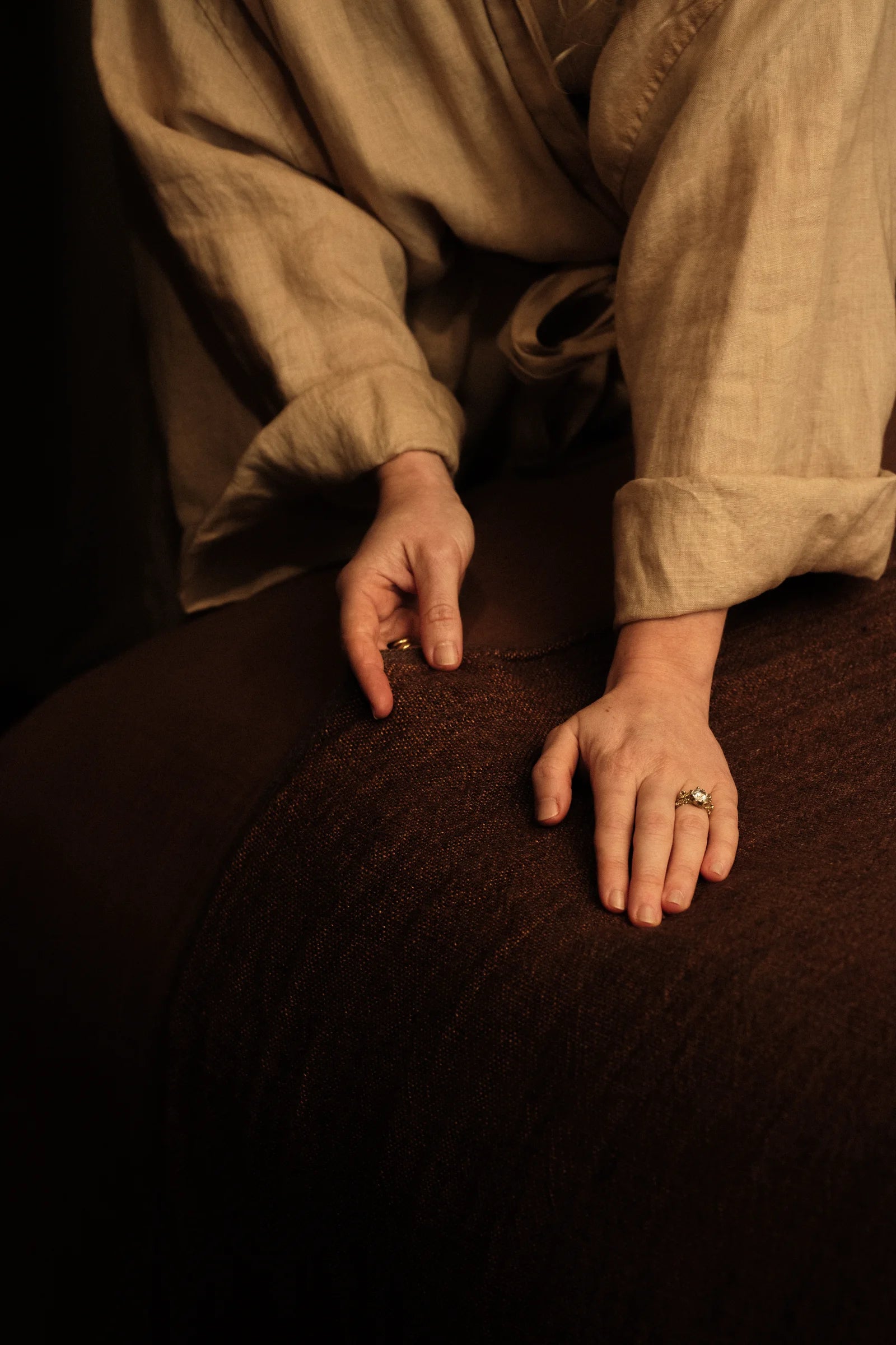 Close-up of Riley Pennington's hands, showing care and connection at RE Studio of Wellness