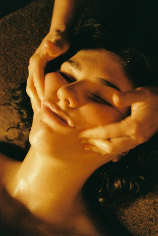 RE New rejuvenating facial treatment with therapist performing massage in Auckland studio